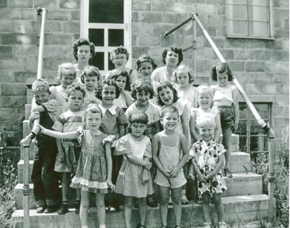 Kids in Front of Original Education Building.png